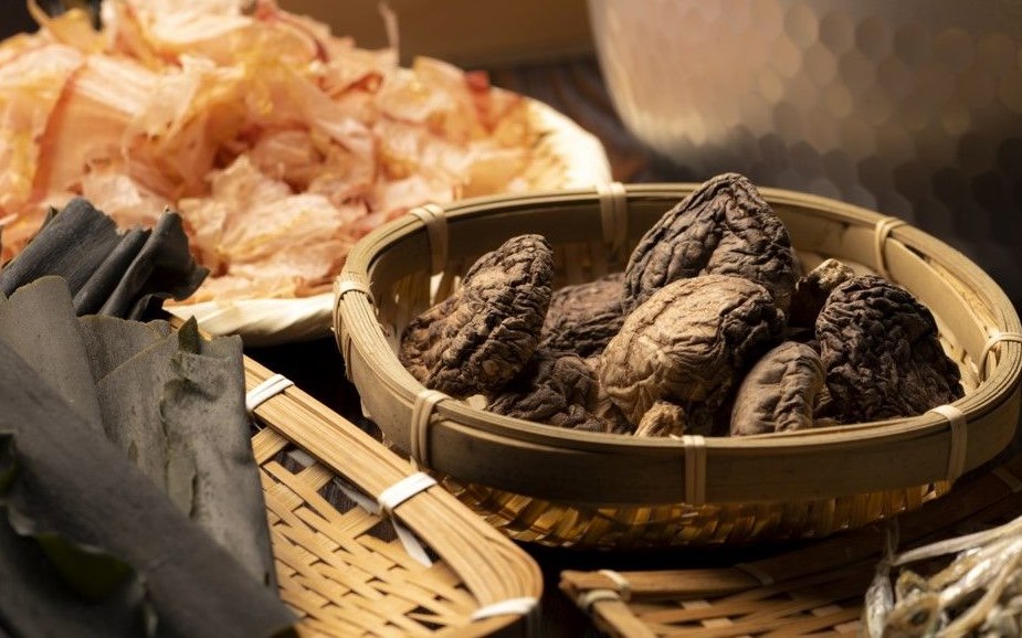 Dashi ingredients including dried kombu kelp, katsuobushi bonito flakes and shiitake mushrooms